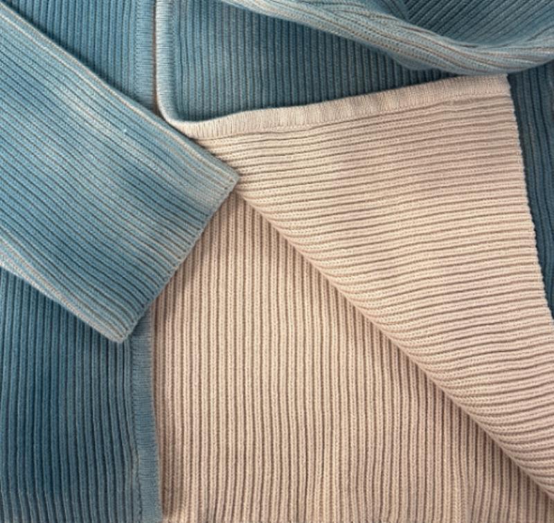 Custom spray-dyed sweater requiring product-specific colorfastness testing